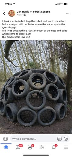 a pile of tires sitting in the middle of a forest