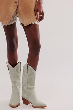 Stun in these so cool western-inspired boots from Jeffrey Campbell featuring classic embroidered details in a luxe leather design with a pointed toe and block heel. Pull-on styleCushioned insoleClassic rounded edgePull tabs on either side | Dagget Western Boots by Jeffrey Campbell at Free People in Blue, Size: US 7.5 Chic Ranch Boots For Spring, Chic Spring Boots For Ranch, Chic Spring Ranch Boots, Chic Summer Boots For Rodeo, Chic Summer Rodeo Boots, Pointed Toe Heeled Boots For Spring At The Ranch, Pointed Toe Heeled Boots For Spring Ranch Events, Chic Heeled Boots For Rodeo In Spring, Spring Pointed-toe Heeled Boots For Ranch