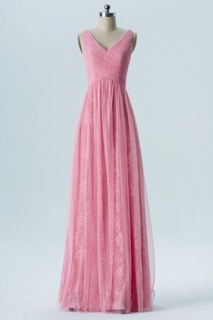 a long pink dress on a mannequin with a v - neck and tulle skirt