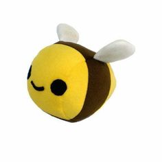 a yellow and brown bee stuffed animal with black spots on it's face, sitting in front of a white background