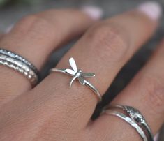 Dragonfly Ring details:-Solid .925 sterling silver-Dragonfly measures 10mm x 8mm,- Ring band measures 1.2mm wide-Comfortable and easily stackable!-Available in US sizes 1-11 with half sizes. Connect with us on Instagram @a_wild_violet for sales and giveaways!**All items are in stock and ship within 2-5 business days from received payment (excluding Saturday/Sunday) from the US. If you are within the US please expect 3-7 business days for shipping transit and delivery. International orders please Bug Ring, Insect Ring, Dragonfly Ring, Dragonfly Jewelry, Favorite Rings, Ring Band, Silver Band, Sterling Ring, Shop Earrings