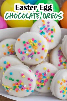 white chocolate covered donuts with sprinkles in a bowl next to colorful eggs