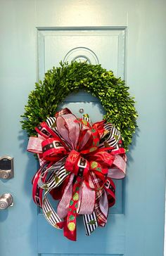 a wreath is hanging on the front door