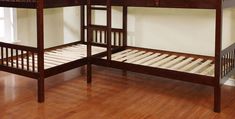 two wooden bunk beds sitting on top of a hard wood floor