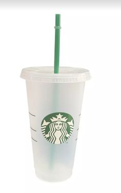 a starbucks cup with a green straw in it