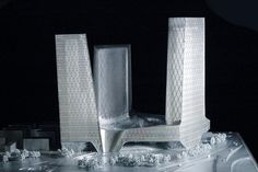 an architectural model of a building with snow on the ground and ice in front of it