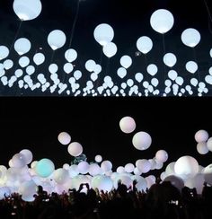 many white balloons are floating in the air