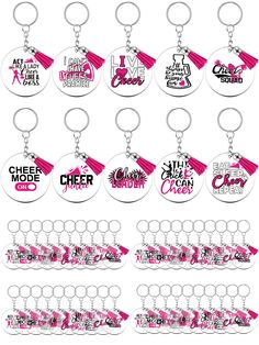 a bunch of key chains that have different designs on them, all in pink and white