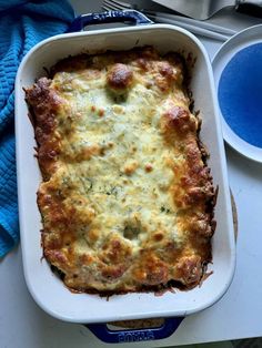 a casserole dish with meat and cheese in it