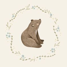 a drawing of a bear sitting in a circle with leaves and flowers around the edges