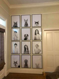 a living room filled with lots of pictures on the wall