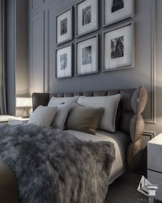 a bedroom with gray walls and pictures on the wall