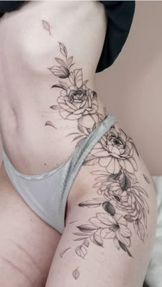 a woman's stomach with flowers on it