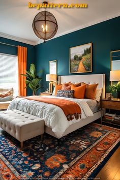 a bedroom with blue walls and orange accents