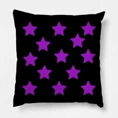 a black pillow with purple stars on it