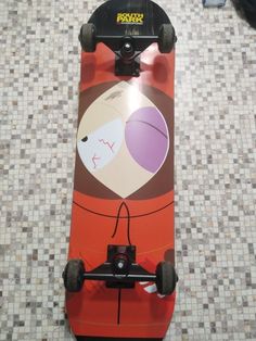 a skateboard with an image of two people on it's front and back wheels