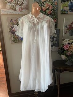 Offered is a vintage peignoir set, nightgown and matching robe from Seamprufe. Snow White in color it's the perfect bridal/anniversary set. Lots of lace. Both pieces are double chiffon. Sheer and see through.  The gown has a pleated skirt and lace straps.  Robe closes with 2 neckline buttons and a tie.  Tagged as size 34 and shown on my size 34 mannequin. Busy measures 36" Under bust 29" Hips are full Length shoulder to hem 40" Condition is excellent. This was someone's special set worn very lit Vintage Peignoir, Nightgown Robe, Matching Robes, Peignoir Sets, Vintage Nightgown, Lingerie Sets, Lace Straps, Lingerie Set, Night Gown