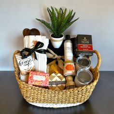 a wicker basket filled with personal care items and a potted plant next to it