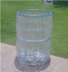 a large plastic water bottle sitting on top of a sidewalk