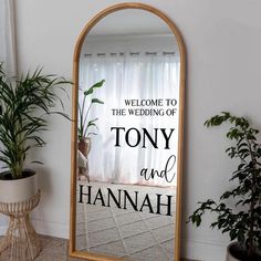 a large mirror with the words, welcome to the wedding of tony and hannah on it