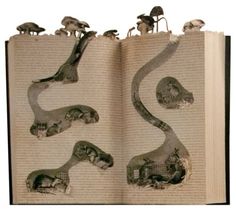 an open book with pictures of animals on it