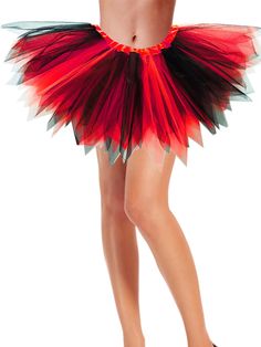 a woman is wearing a red and black skirt with feathers on the bottom, along with high heels