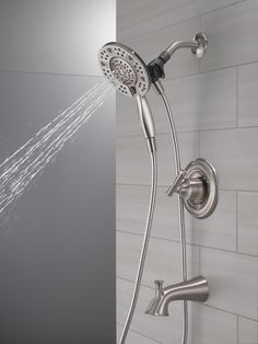 a shower head with the spray coming out of it