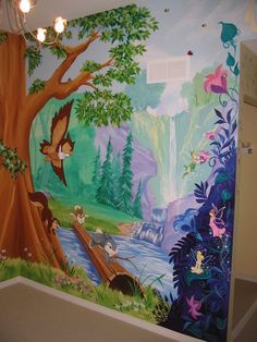 this is a wall mural in a child's room with trees and animals on it