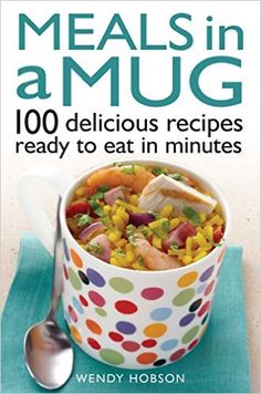 a book cover with a colorful polka dot cup filled with food and the title, feed me a mug 100 delicious recipes ready to eat in minutes