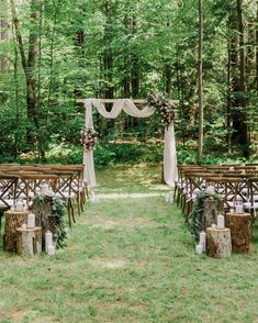 an outdoor ceremony set up in the woods