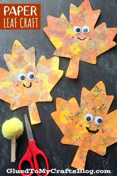 paper leaf craft for fall with scissors and yarn