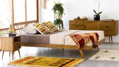 a bed sitting on top of a wooden frame