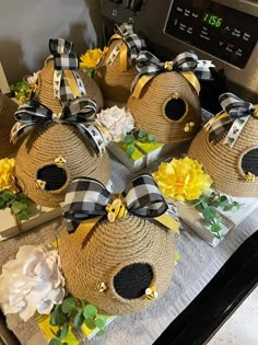 four burlocks with black and white bows on them are sitting on a table