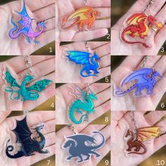 six different colored dragon keychains in various sizes and shapes, on a person's hand