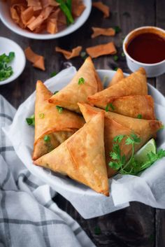 some food is sitting on a plate with dipping sauce