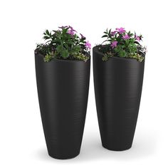 two black planters with purple flowers in them