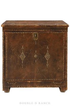 an old leather chest with studded handles