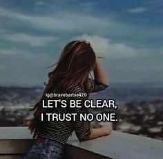 a woman sitting on top of a building next to a window with the words let's be clear, i trust no one