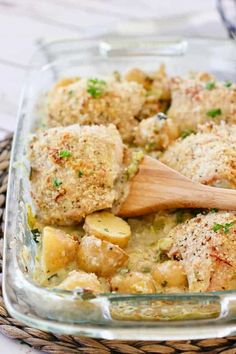 a casserole dish with chicken, potatoes and parmesan cheese in it