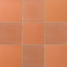 a close up view of an orange colored tile floor with no grouting on it