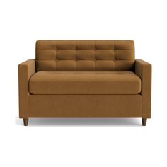 a brown couch sitting on top of a white floor