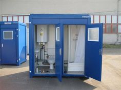 two blue portable toilets sitting next to each other