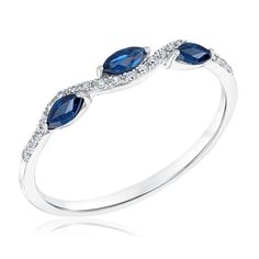 a white gold ring with blue sapphire and diamonds