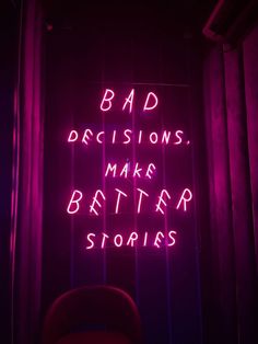 a neon sign that says bad decisions, make better stories on the side of a wall