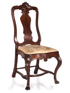 an antique wooden chair with upholstered seat