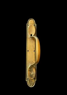 an old fashioned door handle on a black background