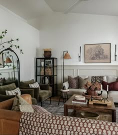 a living room filled with lots of furniture and decor