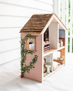 a doll house is shown on the porch