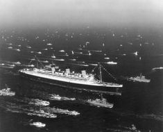 an aerial view of several ships in the ocean