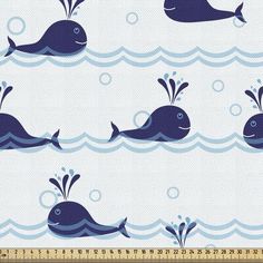 a blue whale pattern on white fabric